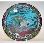 A mid-20th century Japanese cloisonné plate, decorated with cranes amongst flowers and foliage, dia.