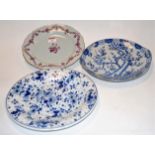 A 19th century Dutch Delft blue and white plate typically decorated with bird amongst flowers,