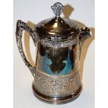 A large Victorian silver plated hot water jug having a ceramic interior,