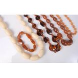 Three faux amber bead necklaces, a bracelet,