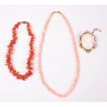 A coral bead necklace, 42cm, a brach coral choker, 28cm long,
