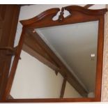 A faux mahogany framed and architectural overmantel mirror,