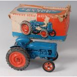A Chad Valley heavy diecast clockwork model of the New Fordson Power Major tractor,