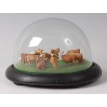 An early 20th century diorama depicting a herdsman amongst cattle,