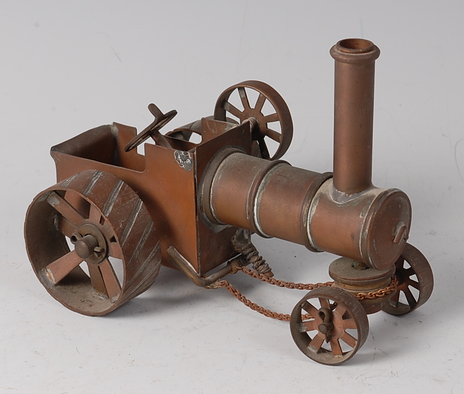 An early 20th century Dribbler type copper and brass model of a steam traction engine,