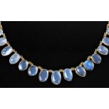 A contemporary moonstone riviere necklace, the slightly graduated oval moonstone cabochons, approx.