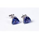 A pair of 18ct tanzanite earstuds, the trilliant cut tanzanites, measuring approx. 7.