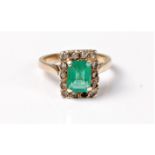 An emerald and white hardstone ring, the emerald cut emerald, approx. 8 x 5.