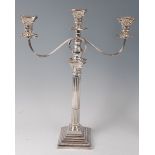 A silver Corinthian column three light candelabrum, having beaded detachable sconces,