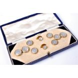 An early-mid 20th century 9ct and mother of pearl gentleman's dress set,