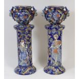 A pair of Continental majolica glazed pedestal jardinieres,