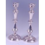 A pair of modern silver candlesticks, having multi-knopped stems and on loaded bases, maker B&Co,