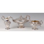 An early Victorian silver pedestal teapot and near-matching twin handled sugar and pedestal cream
