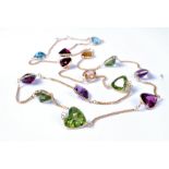 A 14ct multi-gem set necklace, the mixed cut gemstones, to include topaz, garnet, citrine,