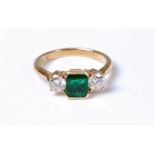 An 18ct emerald and diamond ring, the square emerald cut emerald, approx. 5.7 x 5.