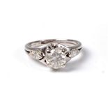 An 18ct diamond ring, the central round brilliant cut diamond, estimated approx. 0.