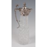 A modern cut glass and silver topped ewer, having finial topped hinged cover,