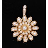 A 19th century pearl pendant/brooch, the flowerhead cluster set with pearls,