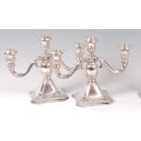 A pair of sterling silver three light candelabra,