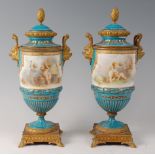 A pair of 19th century French porcelain and ormolu pedestal vases and covers,