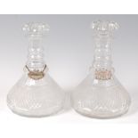 A pair of circa 1830 triple ring-neck ships decanters,