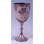 An Edwardian silver pedestal trophy goblet, the chased bowl with presentation inscription, 23oz,