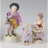 A 19th century Dresden porcelain figure, modelled as a boy astride a goat,