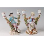 A pair of late 19th century Meissen porcelain figural candelabra,