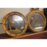 A gilt framed and ball applied convex wall mirror;