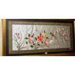 A modern Oriental silkwork panel depicting exotic bird and insect amidst blooming flowers,