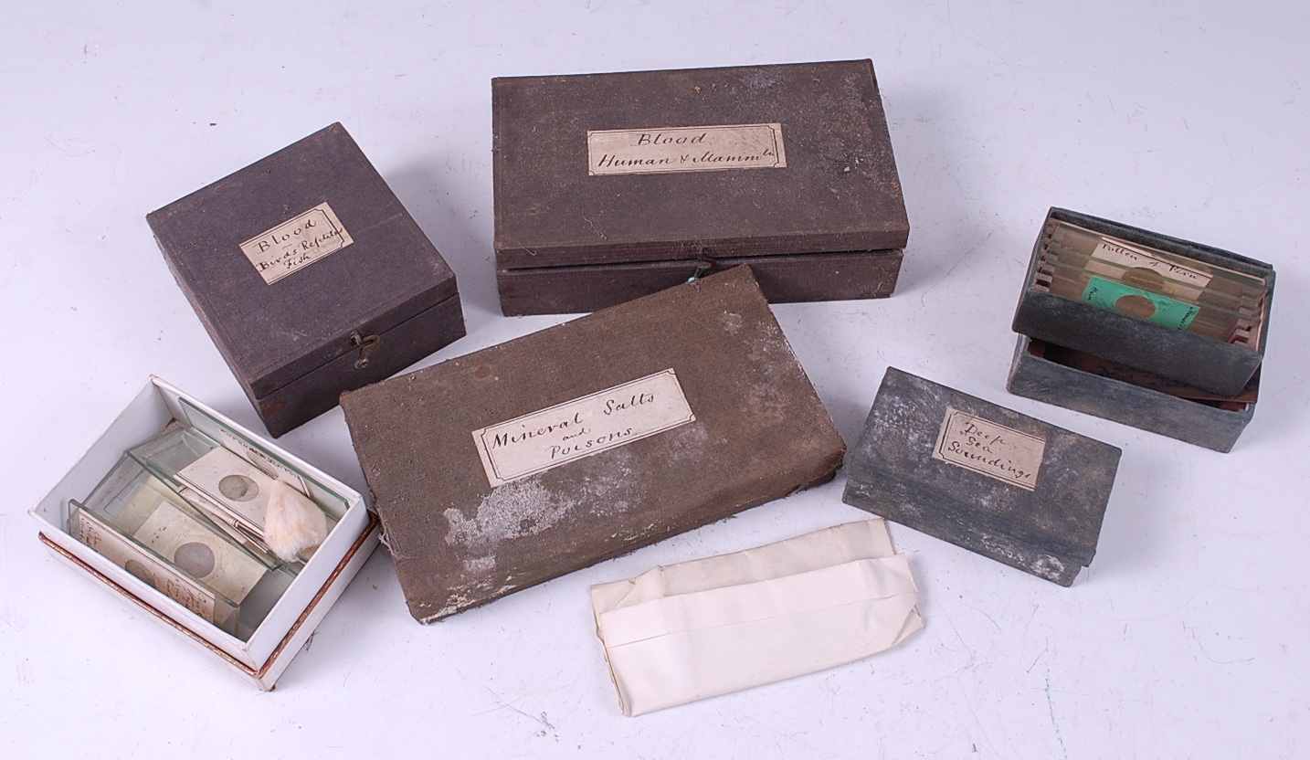 A quantity of specimen slides, the majority annotated and in fitted boxes,