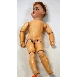 An early 20th century Continental bisque headed doll,