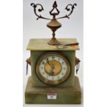 A circa 1900 onyx cased mantel clock, having enamelled chapter ring with Arabic numerals,