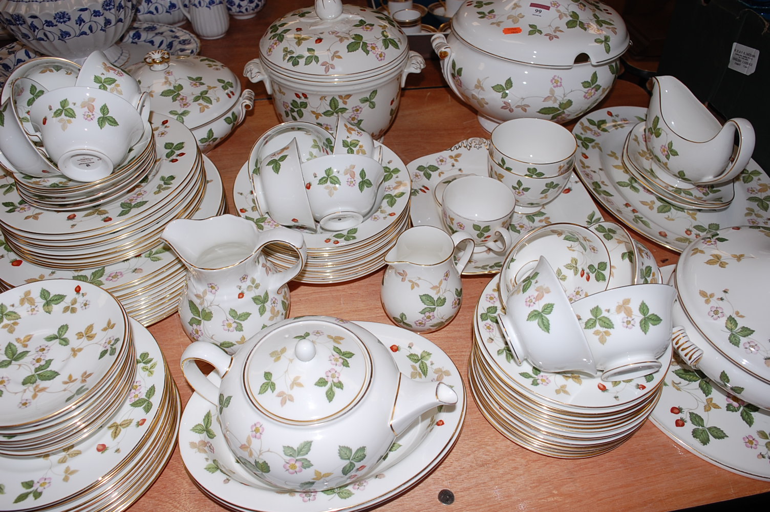 An extensive Wedgwood 12-place setting tea and dinner service in the Wild Strawberry pattern to