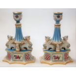 A pair of Continental porcelain figural table candlesticks,