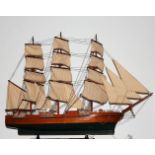 A kit-built wooden model of the frigate Constitution, having three masts, sails and full rigging, h.