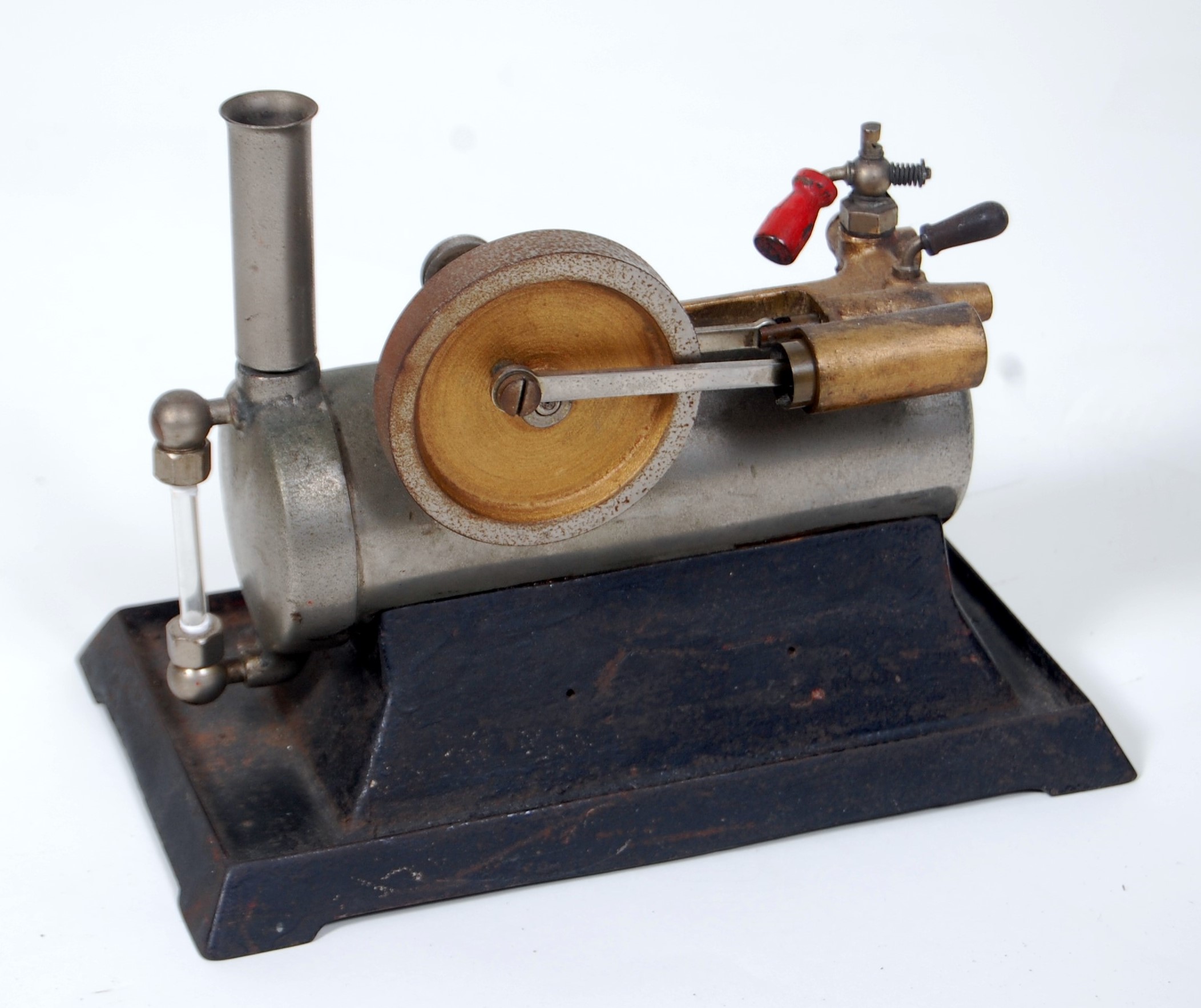 Unusual horizontal steam engine with over type cylinder (Fixed), Iron base,