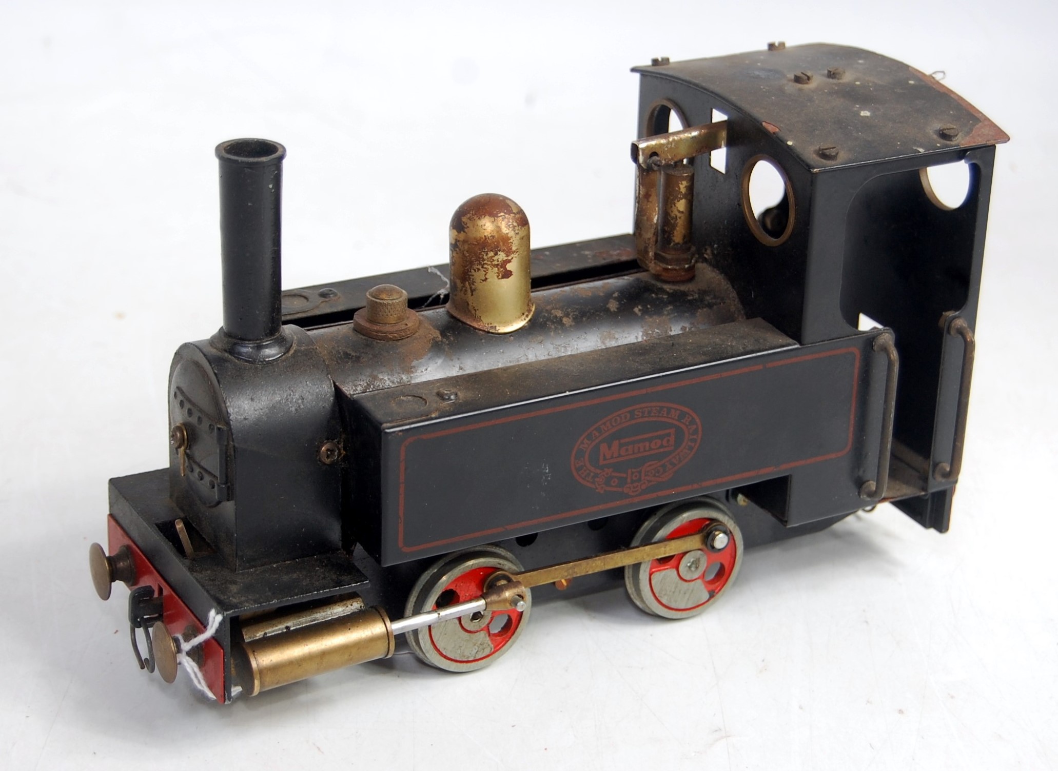 A Mamod SR1 0-4-0 locomotive comprising black body with red lining and brass fittings with original