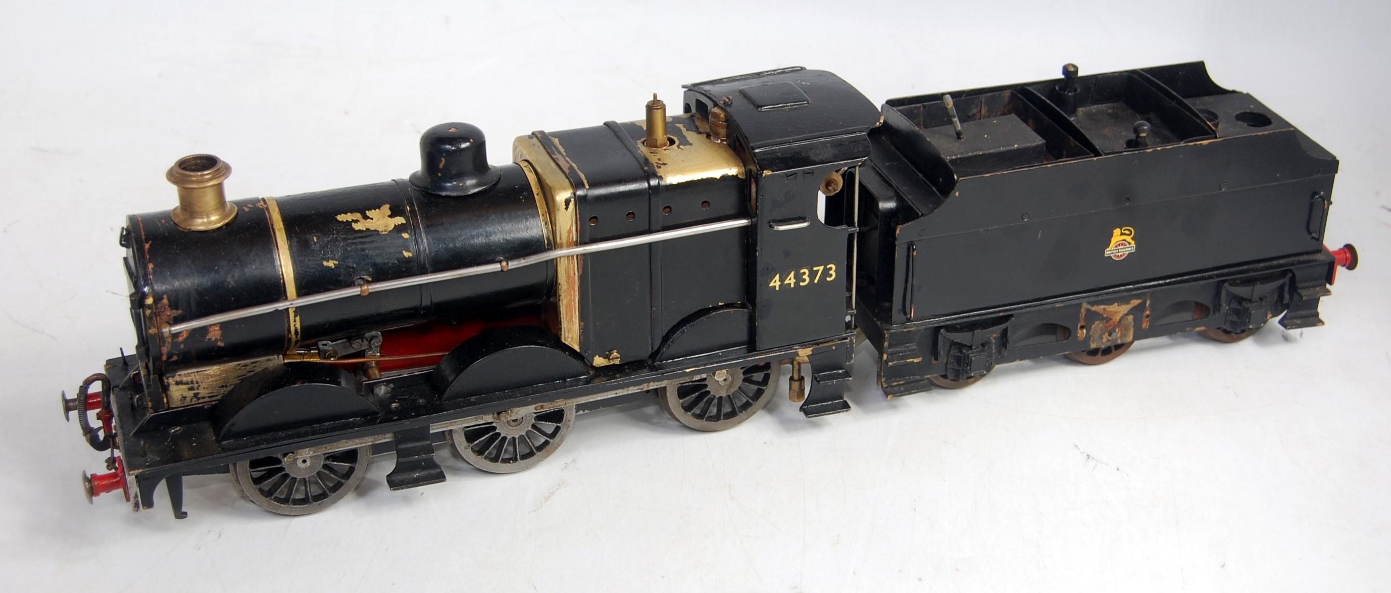 A scratch built live steam 060 locomotive and tender comprising black body with No.