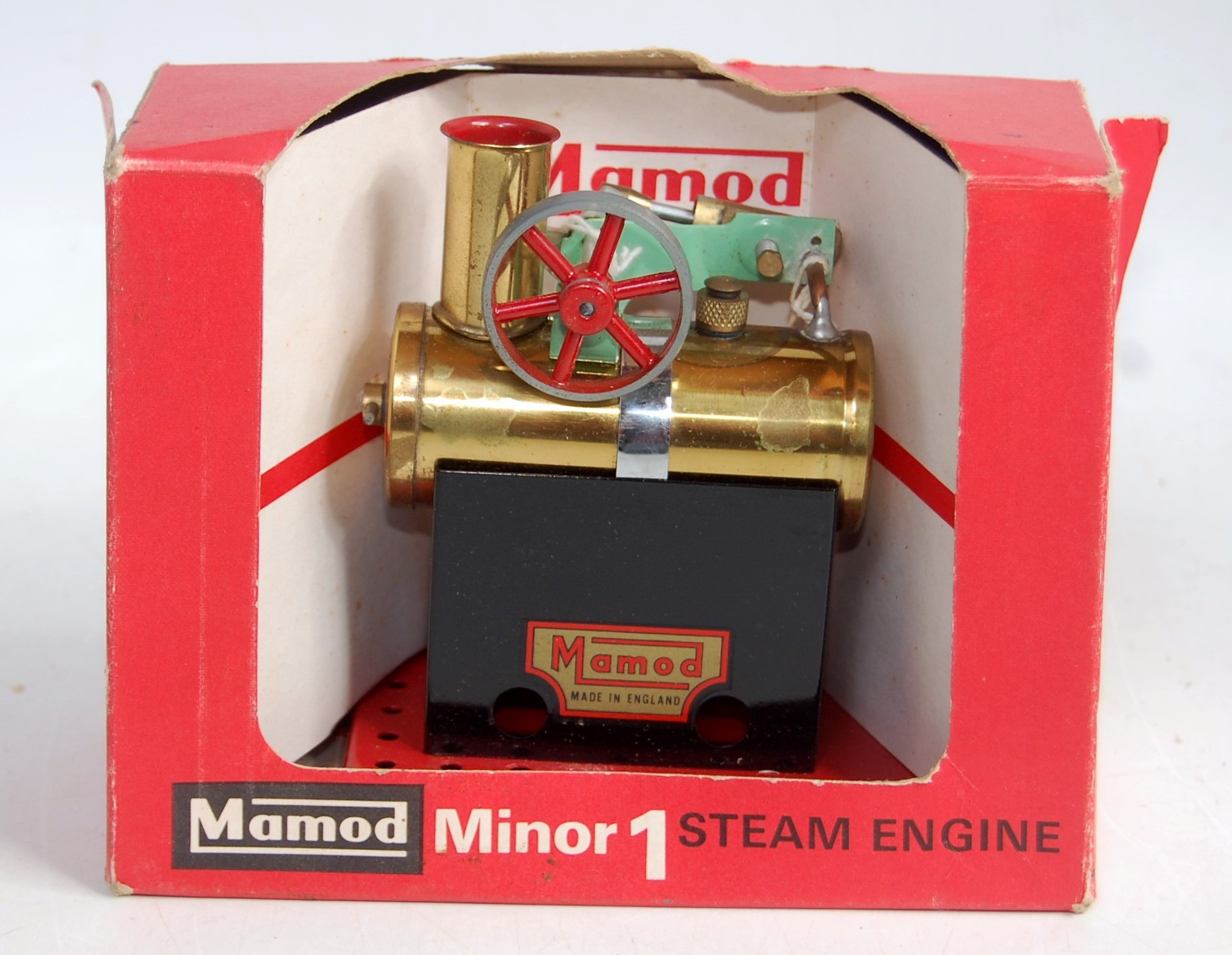 A Mamod Minor 1 steam engine comprising tin housed brass boiler with single oscillating engine,