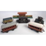 A collection of mixed 00 and 0 gauge tinplate and kit-built locomotives and rolling stock,