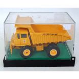 A Gescha diecast model of a Caterpillar 769B rear dump truck,