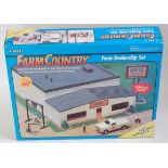 An ERTL Farm Country boxed set titled Farm Dealership set comprising 34 various components,