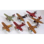 Seven various British tinplate aircraft, all in heavily used/playworn condition,