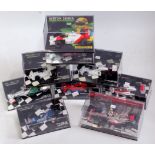 9 various boxed Mini champs 1/43 scale F1 racing car miniatures to include Lewis Hamilton Vodafone