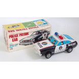 A TN Nomura tinplate plastic and battery operated Police patrol car with mystery action,