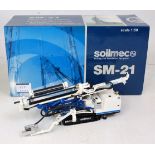 A Soilmec 1/50 scale model of an SM-21 small mobile tracked multi axle drilling rig,