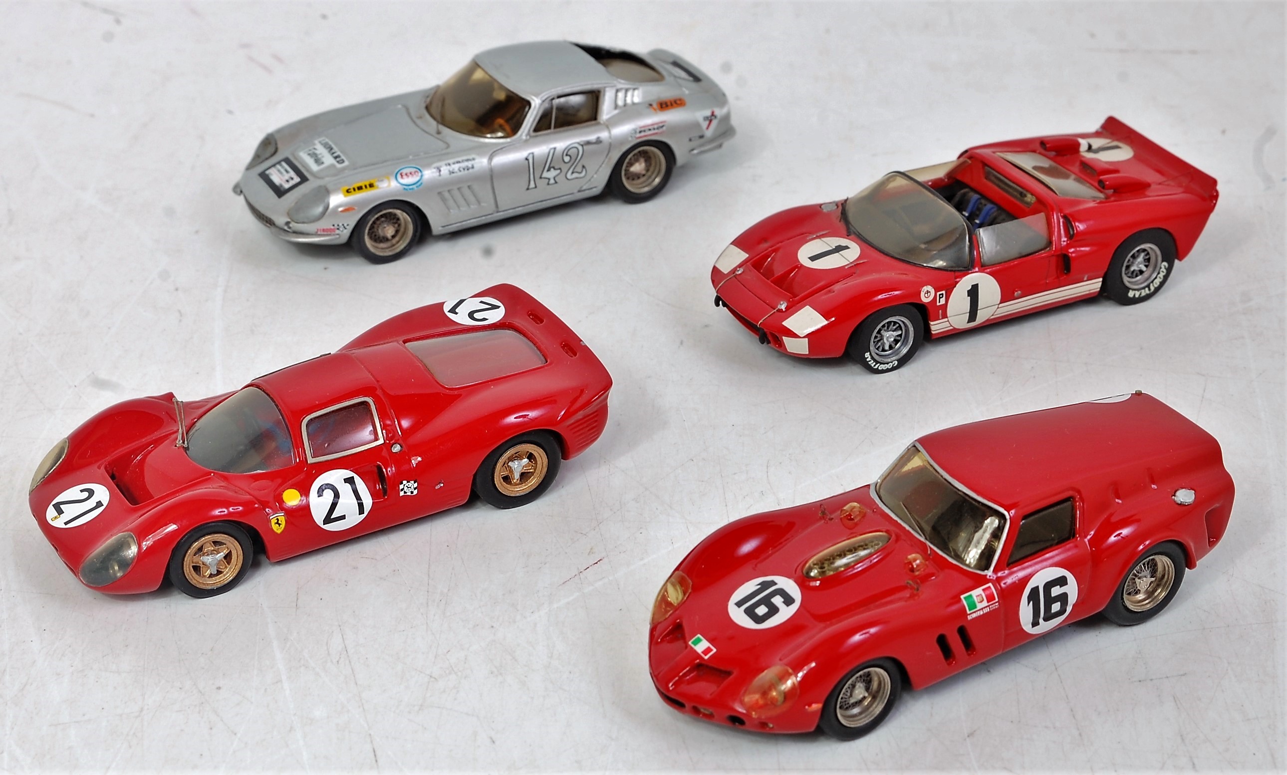 Four various 1/43 scale white metal and resin kit built racing cars to include AD Modles Ferrari
