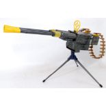 A modern Toys of Japan tinplate and battery operated machine gun comprising of silver,