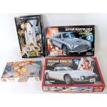 A collection of James Bond 007 plastic kits to include a Doyusha 1/24 scale Aston Martin DB5,